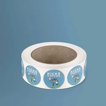 1 Roll of blue circle paper labels. The Blue labels have a coffee cup with arms and lets, and the words reading Kicks coffee